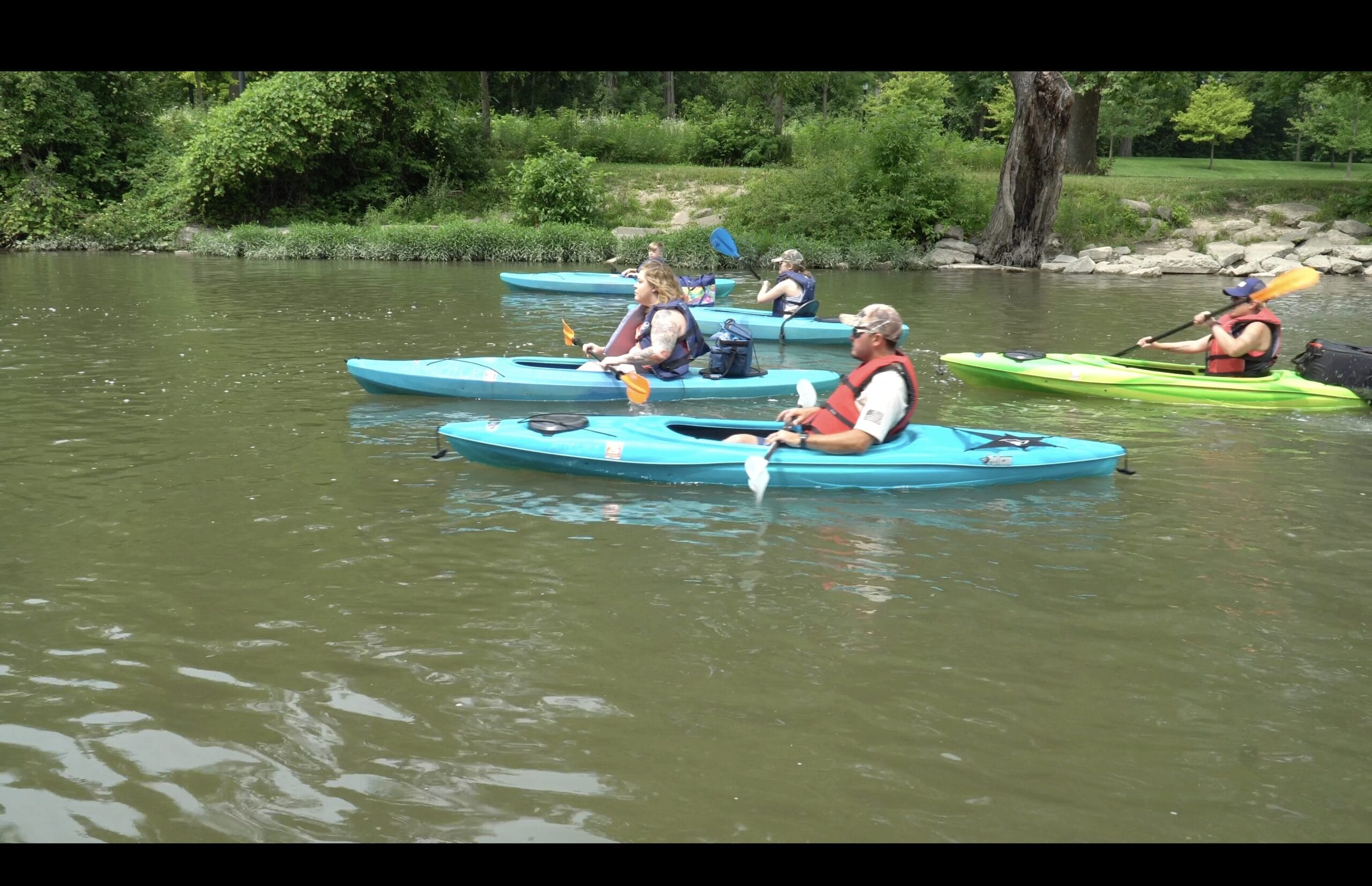 Family kayaking on the Lower Huron River with Atwater Paddles in Flat Rock, Michigan.
